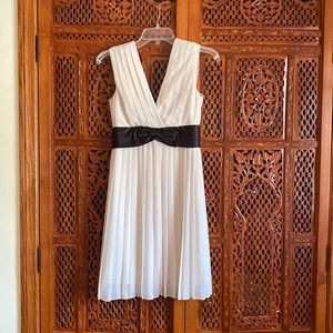 Cocktail dress - short white cream pleated dress with black bow